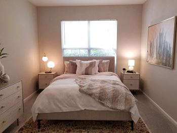 Bedroom with large windows at The Enclave at Crossroads, Raleigh, NC